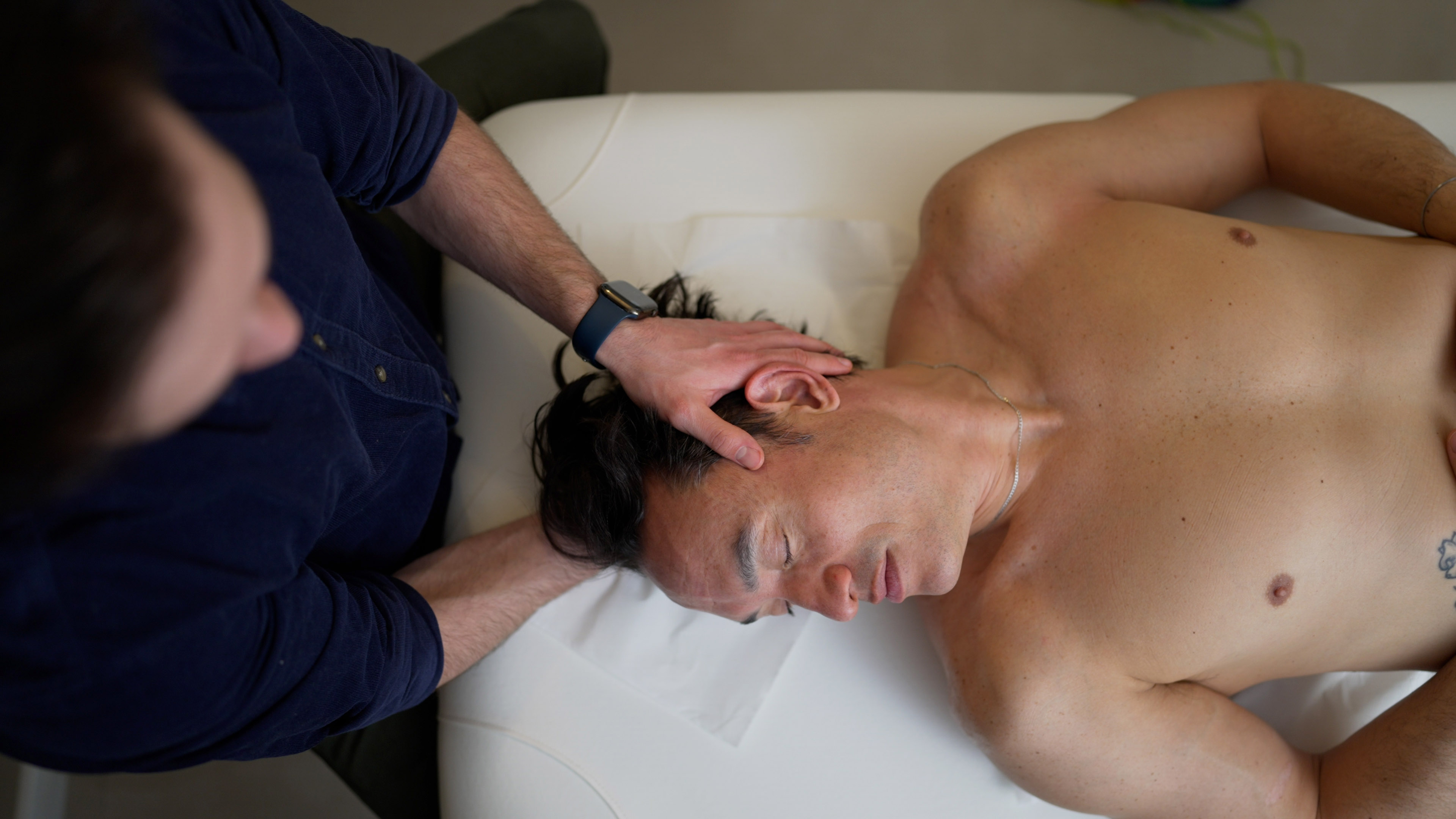 Alex Barmpas performing hands-on neck and cervical therapy